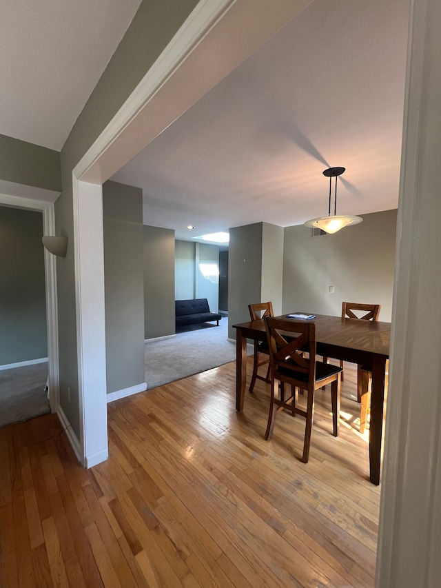 dining space featuring light wood-type flooring