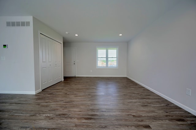 interior space featuring dark hardwood / wood-style flooring and a closet