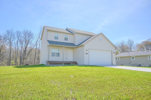 view of front of house with a garage and a front yard