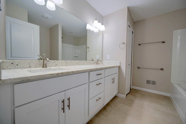 bathroom with vanity and shower with separate bathtub