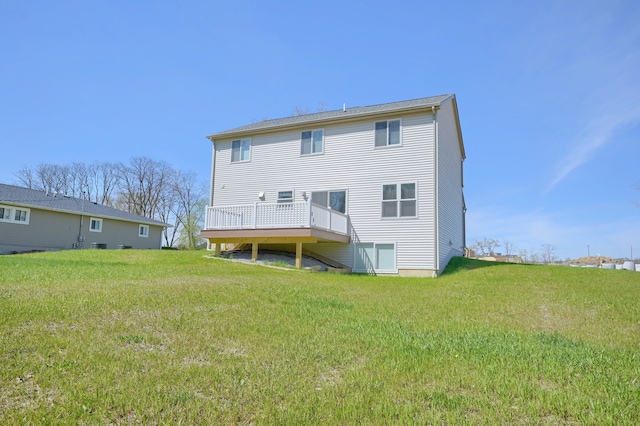 back of house with a yard and a deck