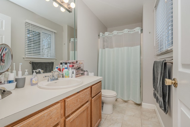 bathroom with vanity, a shower with shower curtain, toilet, and tile patterned flooring