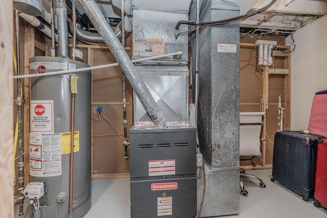 utility room featuring heating unit and gas water heater