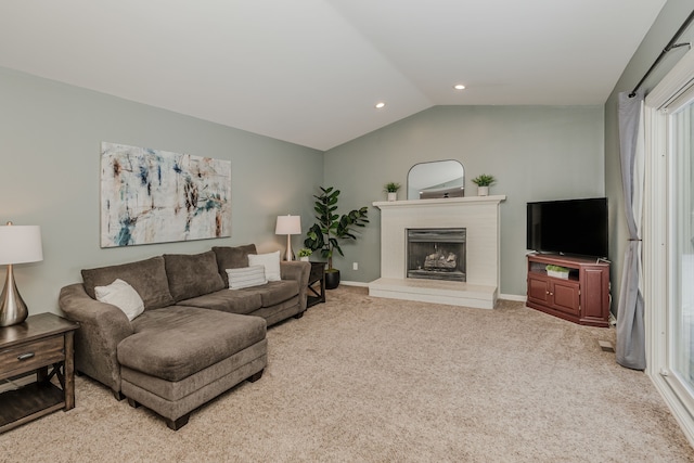 carpeted living room with lofted ceiling