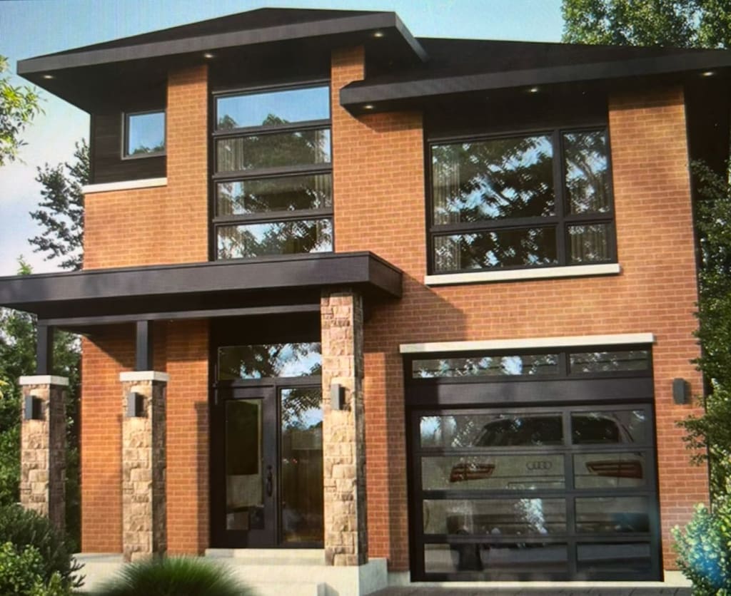 back of house with a garage