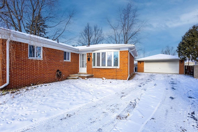 view of front of home featuring an outbuilding and a garage