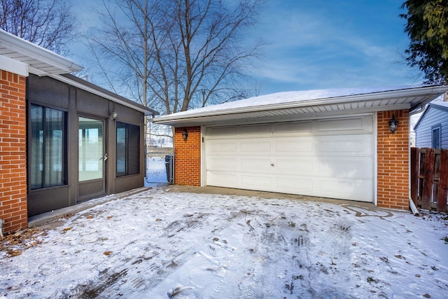 view of snow covered garage