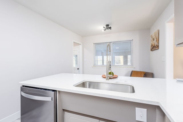 kitchen featuring stainless steel dishwasher and sink