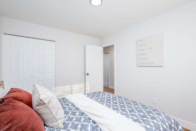 bedroom featuring hardwood / wood-style flooring and a closet