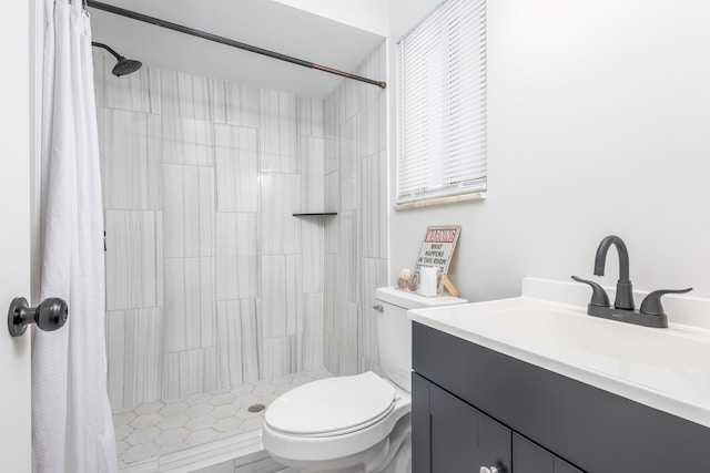 bathroom with vanity, walk in shower, and toilet