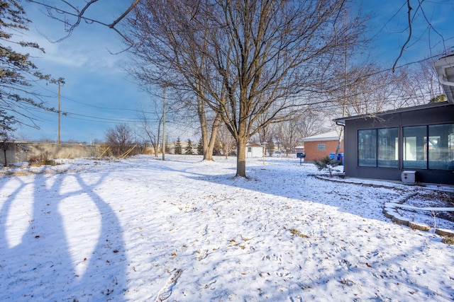 view of yard layered in snow