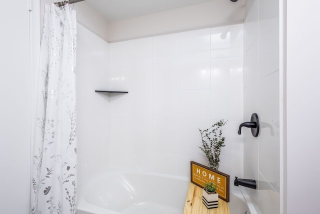 bathroom with shower / bath combination with curtain