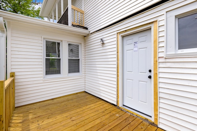 entrance to property with a wooden deck