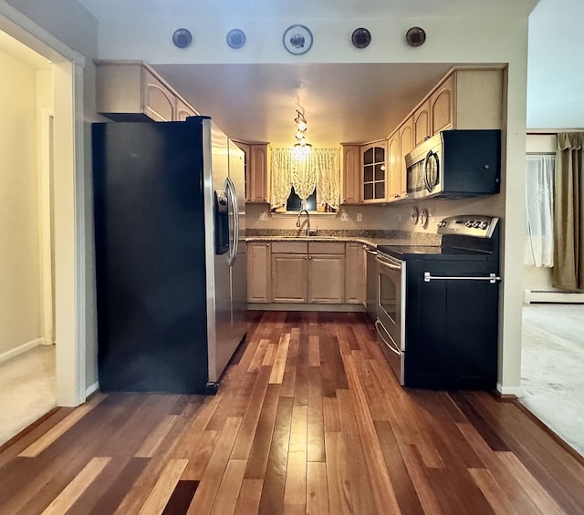 kitchen featuring light brown cabinetry, sink, baseboard heating, dark hardwood / wood-style flooring, and stainless steel appliances