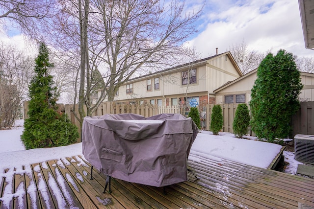 snow covered deck featuring central AC and area for grilling