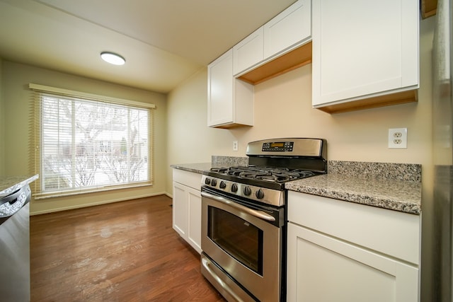 kitchen with light stone counters, dishwasher, gas stove, and white cabinets