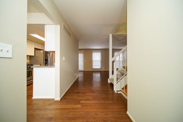 hall with wood-type flooring