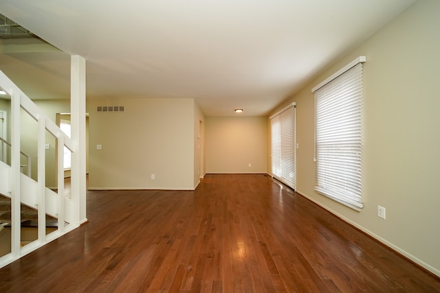 spare room with dark hardwood / wood-style flooring