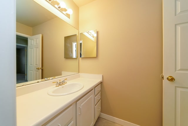 bathroom with vanity and tile patterned flooring