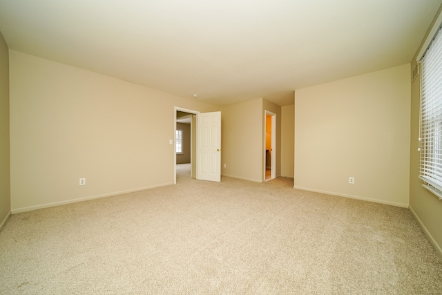 empty room with light colored carpet