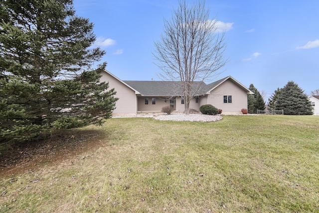 rear view of house with a lawn