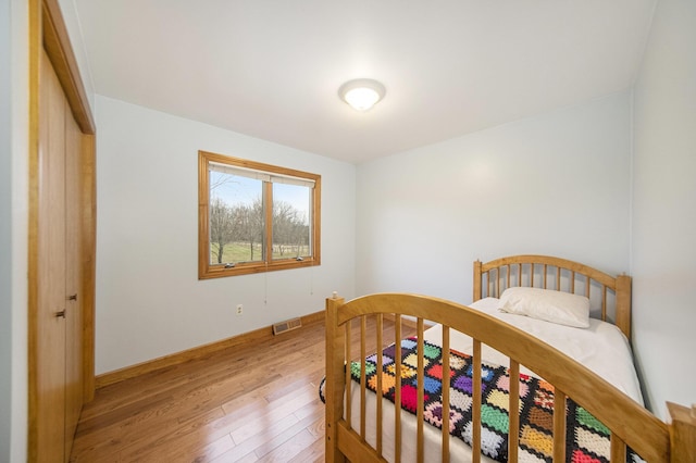 bedroom featuring hardwood / wood-style floors