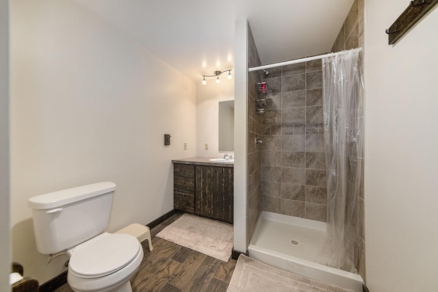 bathroom with vanity, a shower with shower curtain, and toilet