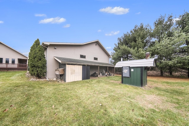 back of property with a storage shed and a yard