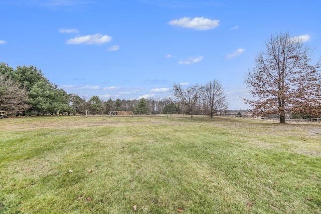 view of yard with a rural view