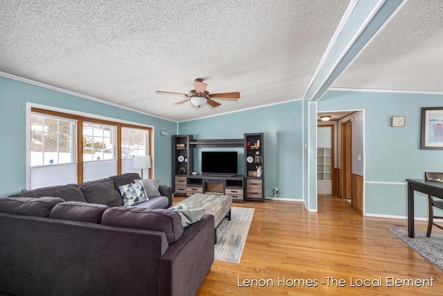 living room featuring lofted ceiling, crown molding, ceiling fan, light hardwood / wood-style floors, and a textured ceiling