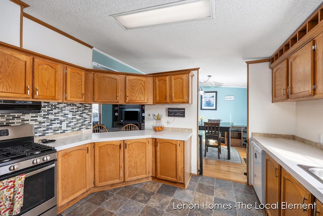 kitchen with extractor fan, lofted ceiling, backsplash, white dishwasher, and stainless steel range with gas stovetop