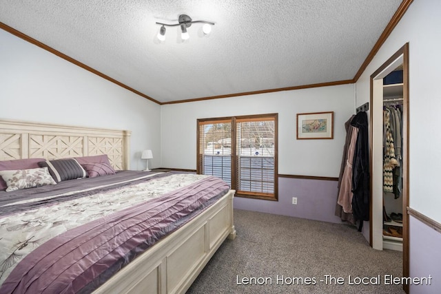 carpeted bedroom featuring a textured ceiling and a closet