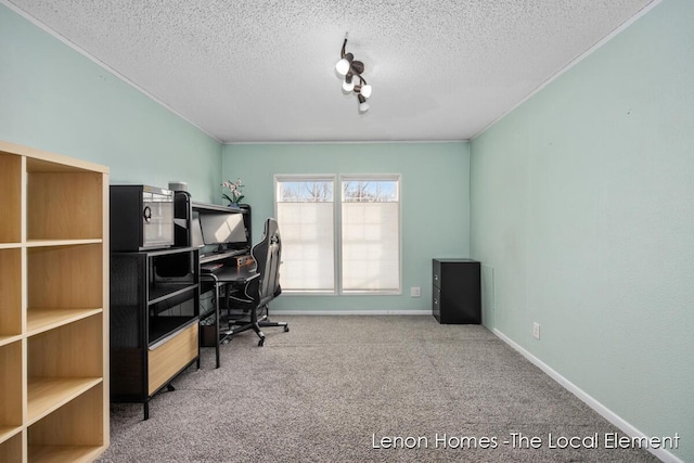 carpeted office featuring a textured ceiling