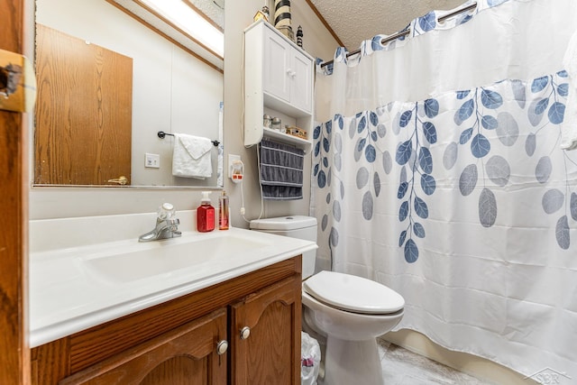 bathroom with vanity, toilet, a shower with shower curtain, and a textured ceiling