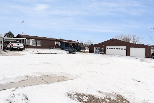 view of front of property with an outbuilding and a garage