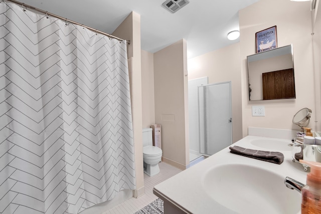 bathroom with vanity, tile patterned flooring, and walk in shower