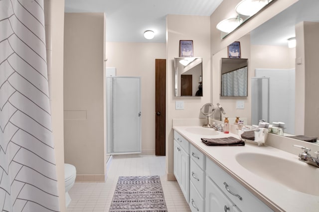 bathroom with vanity, toilet, and a shower with shower curtain