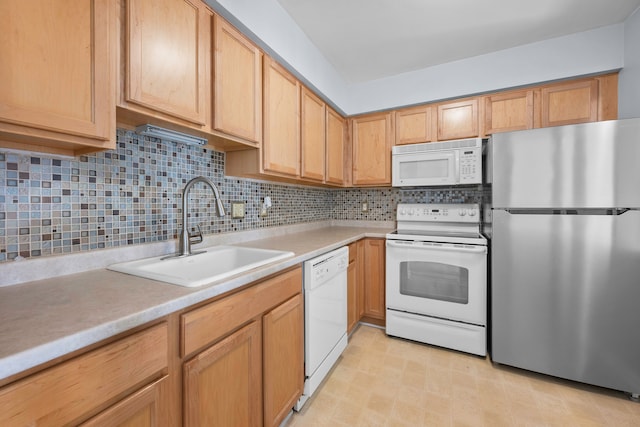 kitchen featuring white appliances, sink, and decorative backsplash