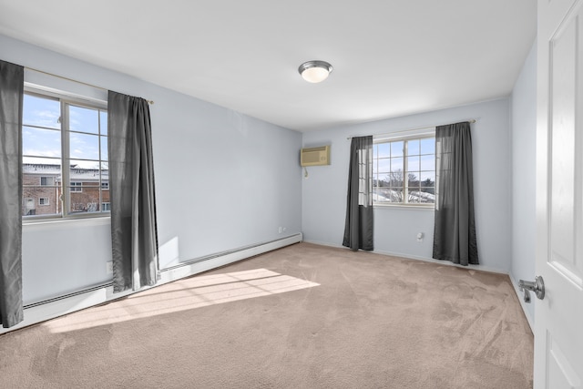 empty room featuring a wall mounted AC, a baseboard heating unit, and light carpet