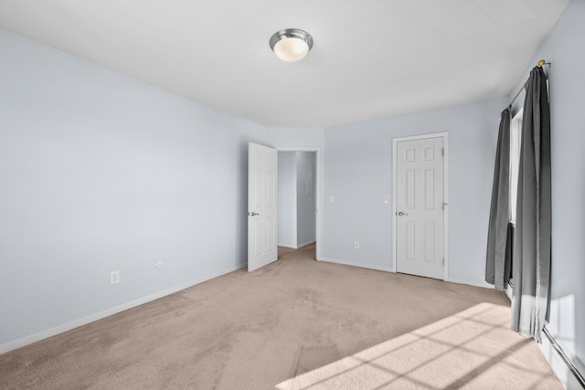 unfurnished room with light colored carpet