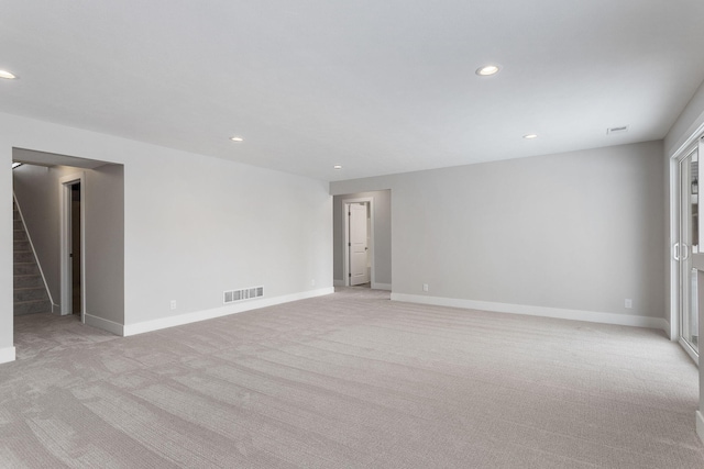 empty room featuring light colored carpet