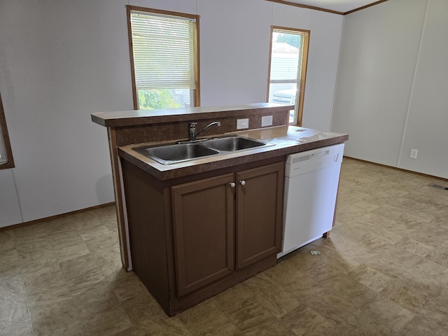 kitchen with sink, dark brown cabinets, ornamental molding, dishwasher, and an island with sink