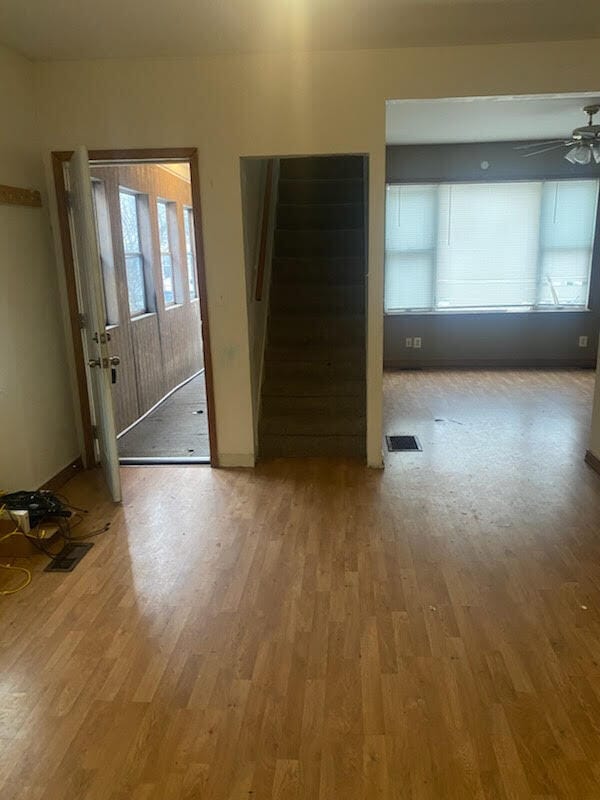 spare room with hardwood / wood-style flooring and ceiling fan