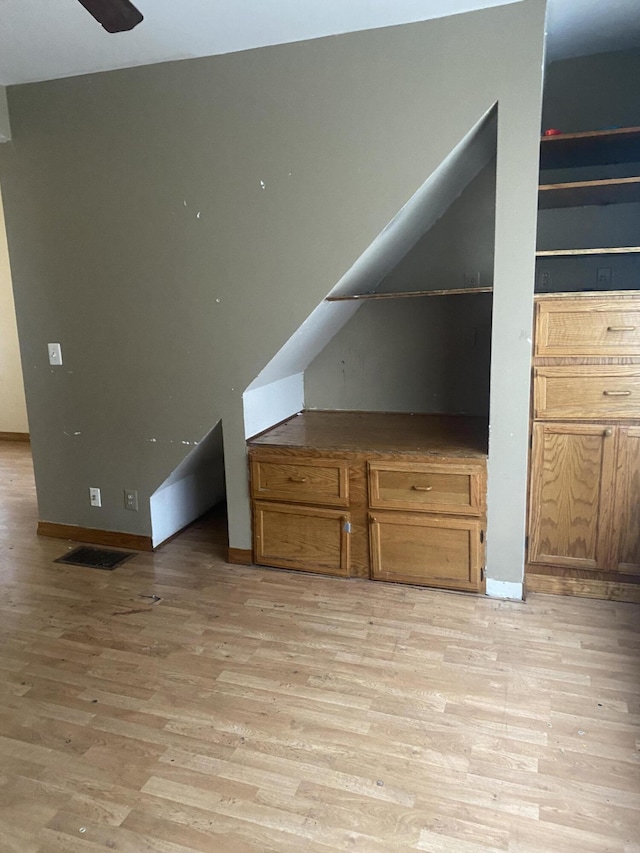 bonus room featuring light hardwood / wood-style flooring, ceiling fan, and vaulted ceiling