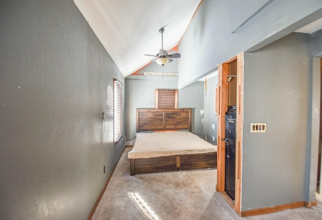 unfurnished bedroom with vaulted ceiling, light carpet, and ceiling fan