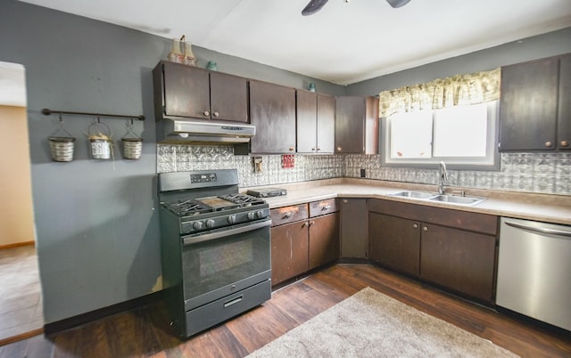 kitchen with sink, dark hardwood / wood-style floors, dark brown cabinetry, range with gas cooktop, and stainless steel dishwasher