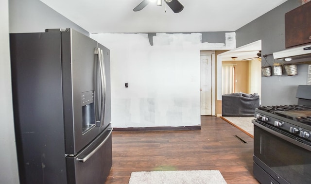 kitchen featuring black gas range oven, dark wood-type flooring, ceiling fan, and stainless steel fridge with ice dispenser