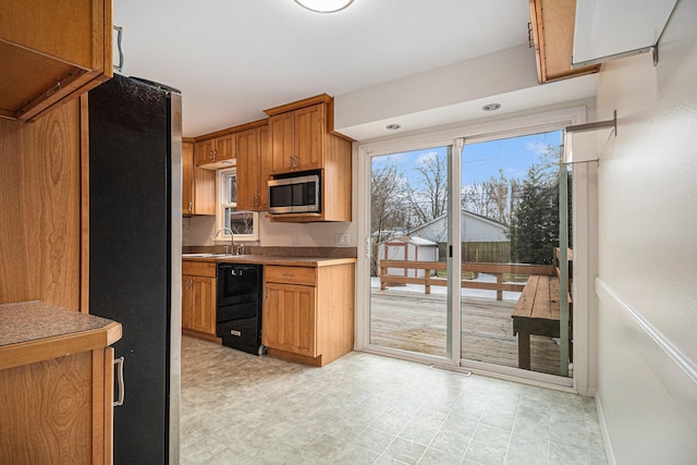 kitchen with sink and appliances with stainless steel finishes