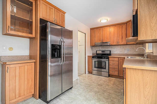 kitchen featuring sink, decorative backsplash, and appliances with stainless steel finishes