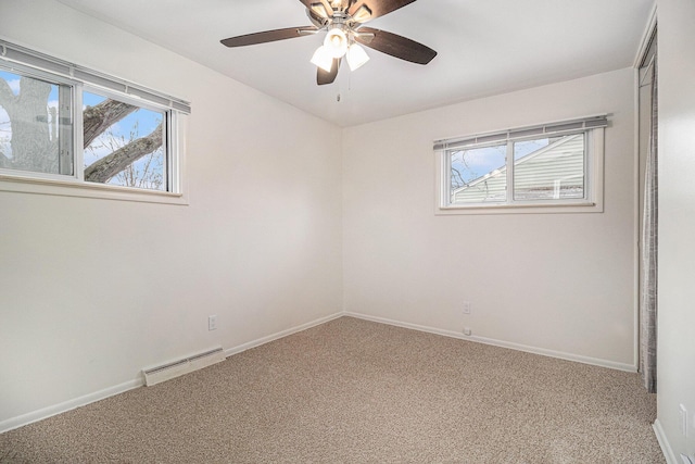 carpeted empty room featuring ceiling fan